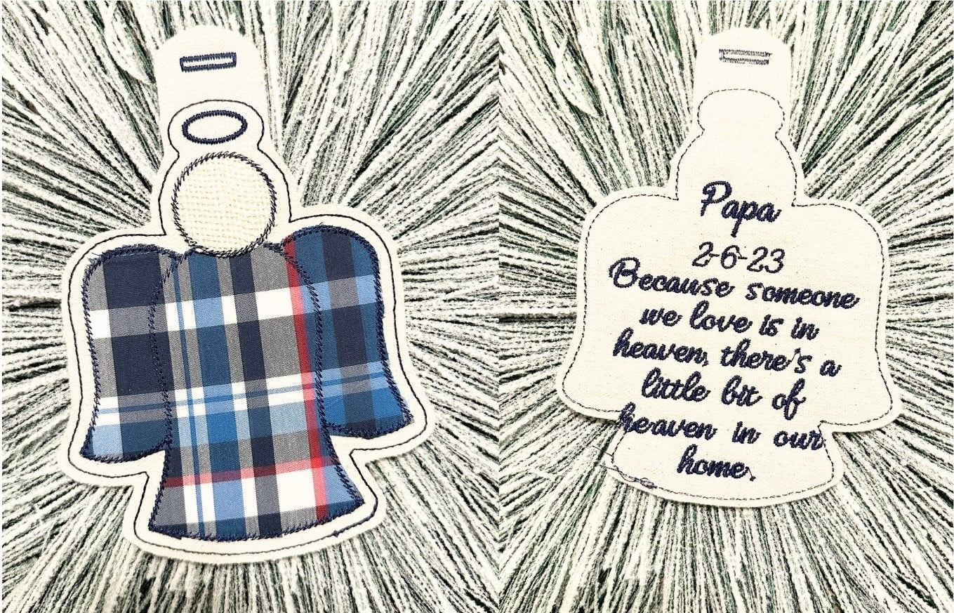 Angel-shaped ornaments with one article of clothing from a loved one and embroidered loved one's name, death date, and quote