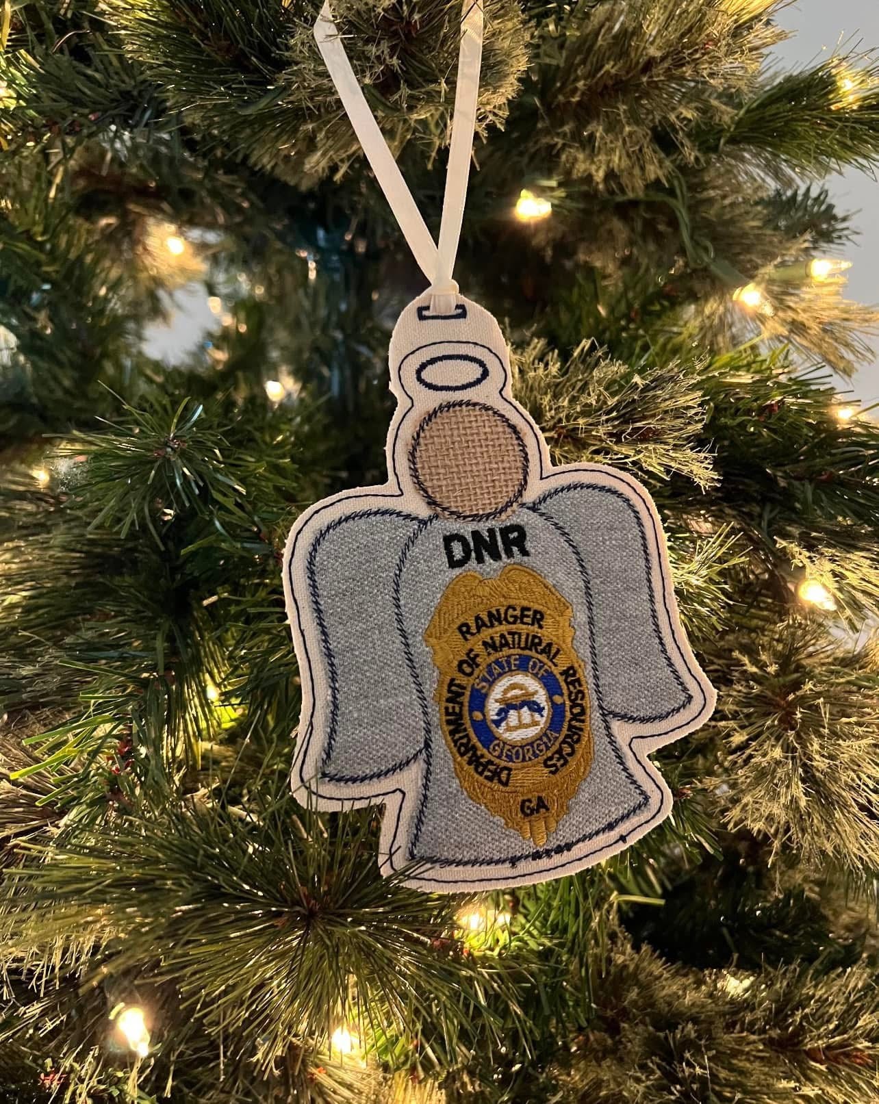 Angel-shaped ornament with one article of clothing from a loved one's uniform, the DNR badge