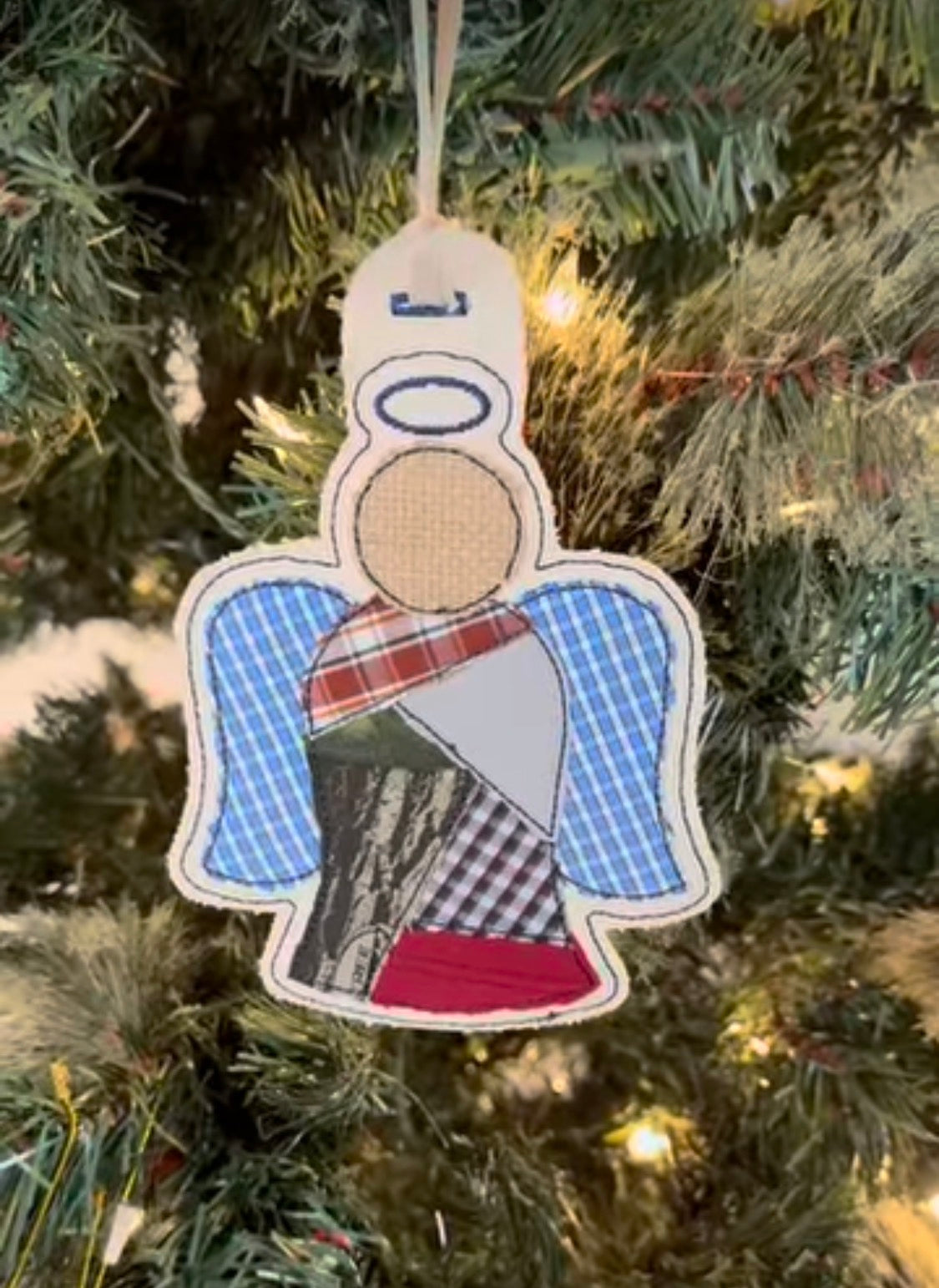 Angel-shaped ornament with six articles of clothing from a loved one