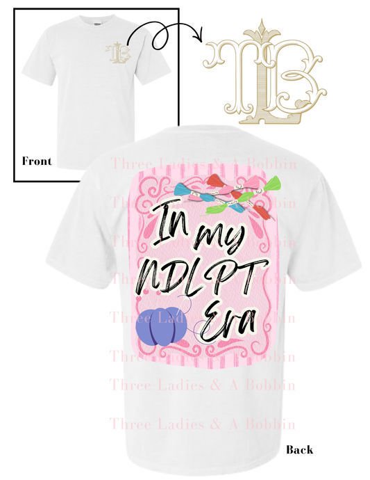 White t-shirt with pink graphic and "In My NDLPT Era" text