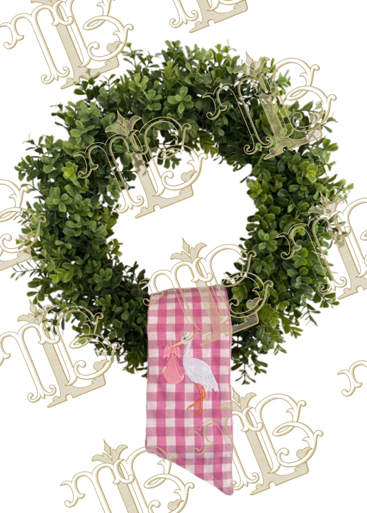 Pink and white gingham sash with embroidered stork